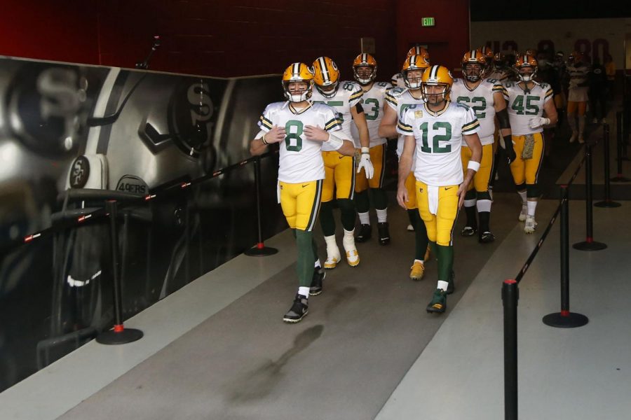 Green Bay Packers quarterback Tim Boyle (8), quarterback Aaron Rodgers (12) and teammates walk out of a tunnel before an NFL football game against the San Francisco 49ers in Santa Clara, Calif., Thursday, Nov. 5, 2020. 