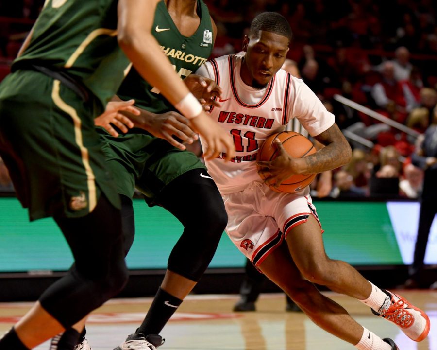 WKU guard Taveion Hollingsworth (11) tries to move inside at the Charlotte v WKU basketball game on Feb 22, 2020 in Diddle Arena. The Hilltoppers were defeated 72-20.