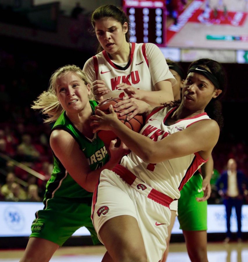 Marshall+freshman+guard+Savannah+Wheeler+%28left%29%2C+WKU+junior+forward+Raneem+Elgedawy+%28top%29+and+WKU+redshirt+senior+forward+Dee+Givens+%28right%29+battle+for+possession+during+the+womens+basketball+game+against+Marshall+on+Thursday%2C+Feb.+20.+The+Lady+Toppers+defeated+the+Thundering+Herd+79-65.