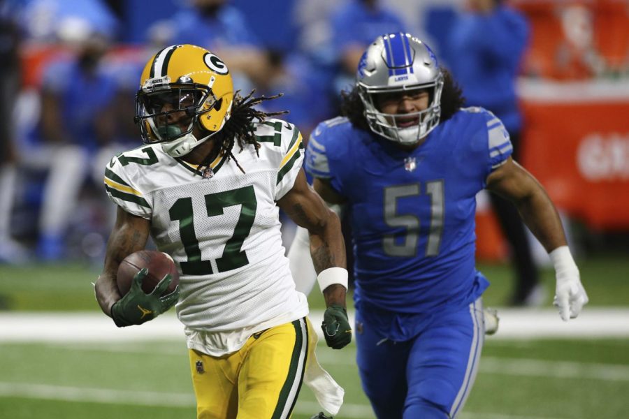 Green Bay Packers wide receiver Davante Adams pulls away from Detroit Lions outside linebacker Jahlani Tavai for a touchdown during the first half on Sunday, Dec. 13, 2020, in Detroit. 
