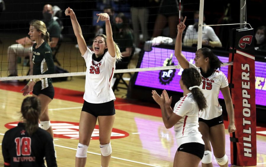 WKU+Volleyball%E2%80%99s+Kate+Isenbarger+%2820%29+celebrates+a+block+with+her+teammates+to+add+to+the+Hilltoppers+lead+in+the+set+Nov.+7%2C+2020.