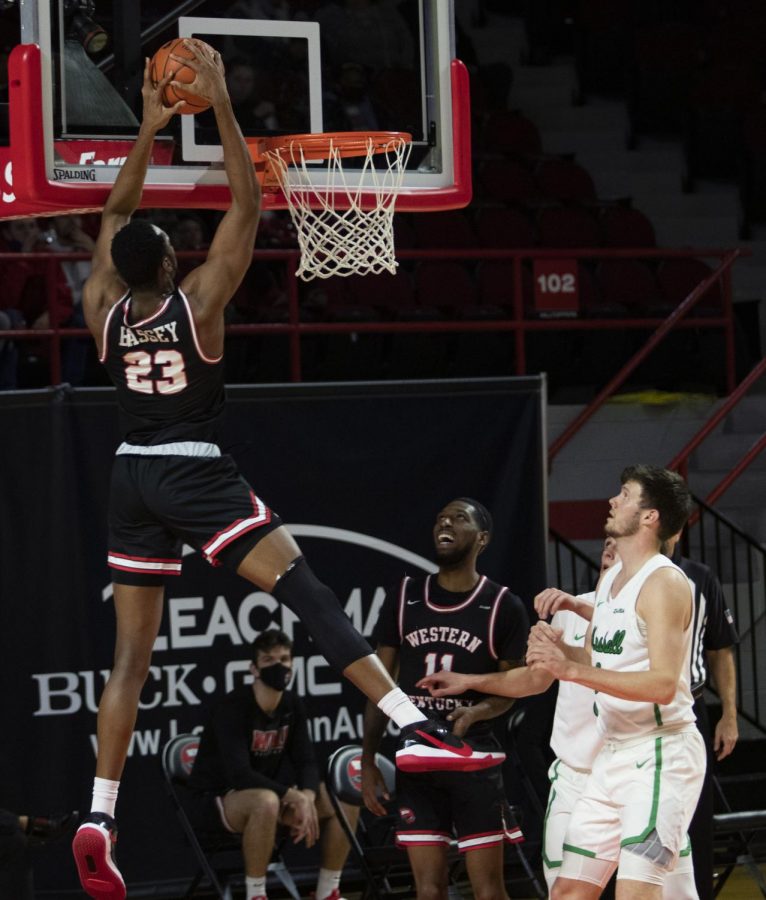 Western Kentucky University junior Charles Bassey (23) attempts to dunk the ball during Friday nights game in E.A. Diddle Arena on Jan 15, 2021. The WKU Hilltoppers defeated the Marshall University Thundering Herd 81-73.