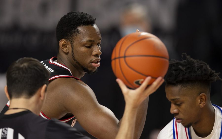 WKU+Hilltopper+junior+center+Charles+Bassey+%2823%29+calms+himself+for+the+tipoff+at+the+game+against+the+LA+Tech+Bulldogs+on+Jan.+9%2C+2021+in+Diddle+Arena.