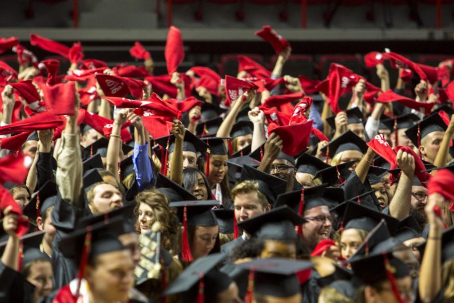 Graduates+wave+their+red+towels+near+the+end+of+the+Potter+College+of+Arts+%26+Letters+and+University+College+commencement+ceremony+Feb.+20%2C+2021%2C+at+Diddle+Arena.