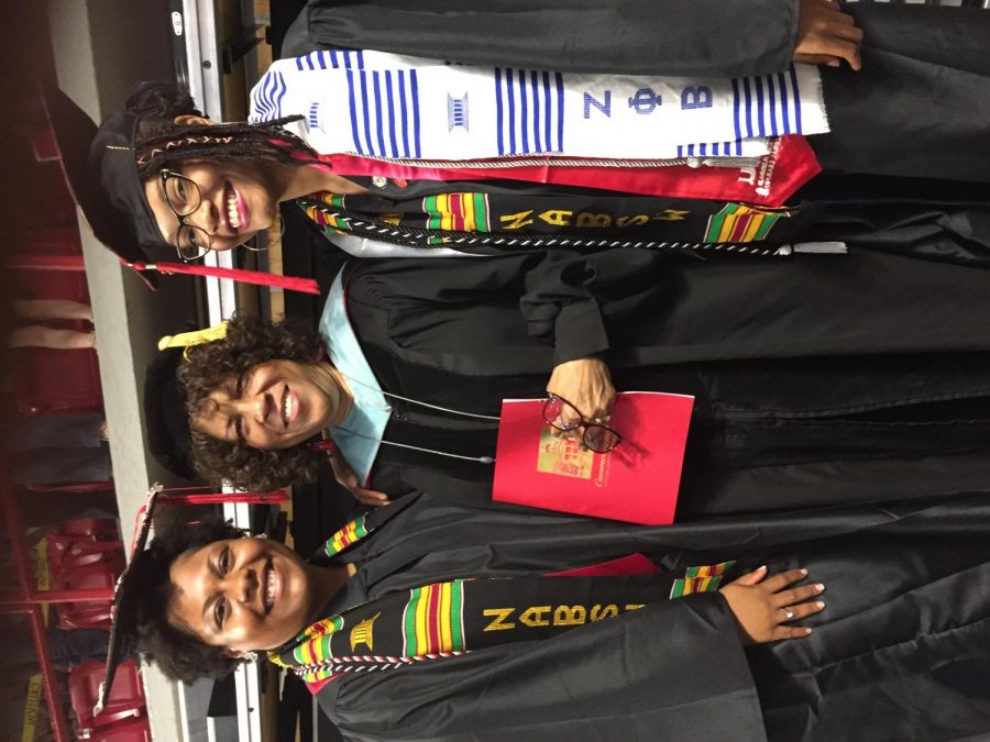 Saundra Starks stands with students who are members of Association of Black Social Workers at WKU spring graduation ceremony in 2018.