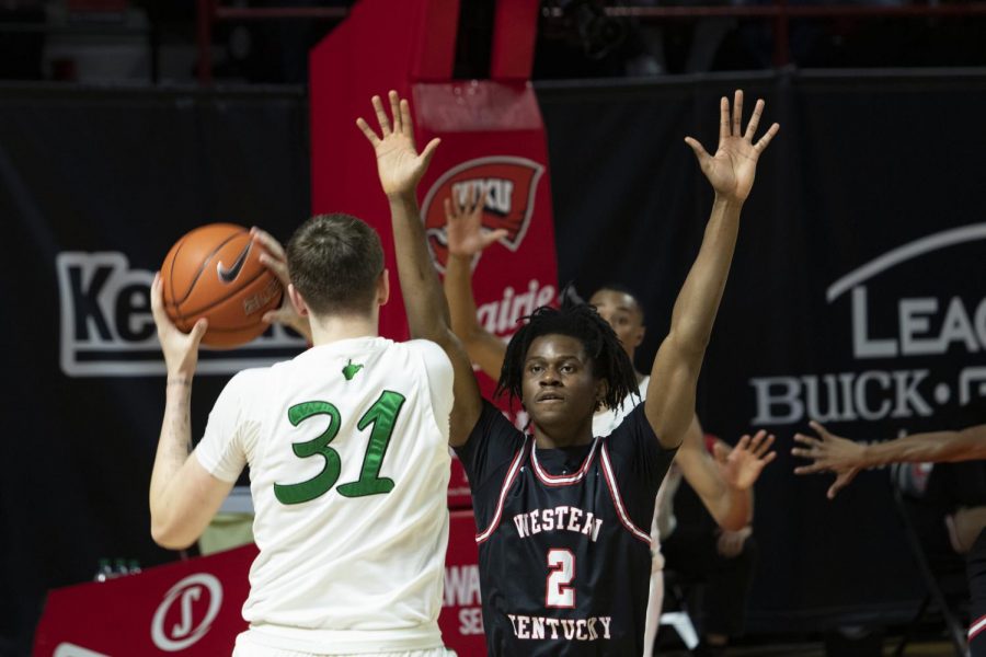 Western Kentucky University forward Kevin Osawe (2) guards Marshall University senior Mikel Beyers (31) during the WKU vs. Marshall University game in Diddle Arena on Jan. 15, 2021. The WKU Hilltoppers defeated the Marshall Thundering Herd 81-73.