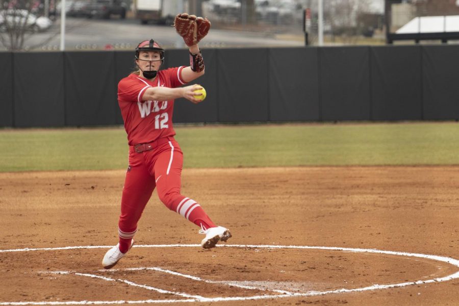 WKU+pitcher+Kelsey+Aikey+%2812%29+throws+out+a+strike+against+Indiana+state+university+on+Feb+27%2C+2021+at+the+WKU+softball+field.+The+Hilltoppers+defeated+the+sycamore+6-0+in+the+Hilltopper+Classic+to+get+their+first+at+home+victory.