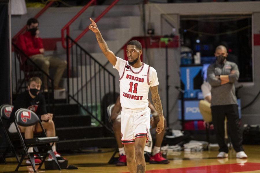 WKU basketball’s Taveion Hollingsworth points across court to a teammate after a good assist during their game against Old Dominion on March 5, 2021.