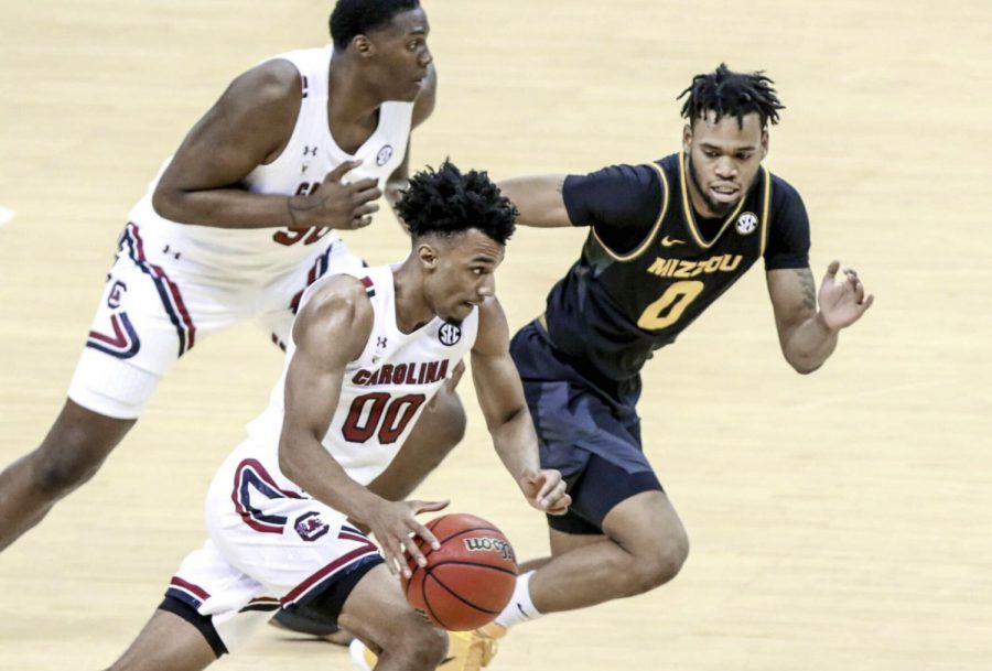 South Carolina guard AJ Lawson (00) dribbles as Missouri guard Torrence Watson (0) pursues during a game Feb. 20 at the Colonial Life Arena in Columbia, S.C. Watson hentered the transfer portal, a spokesperson confirmed Wednesday.