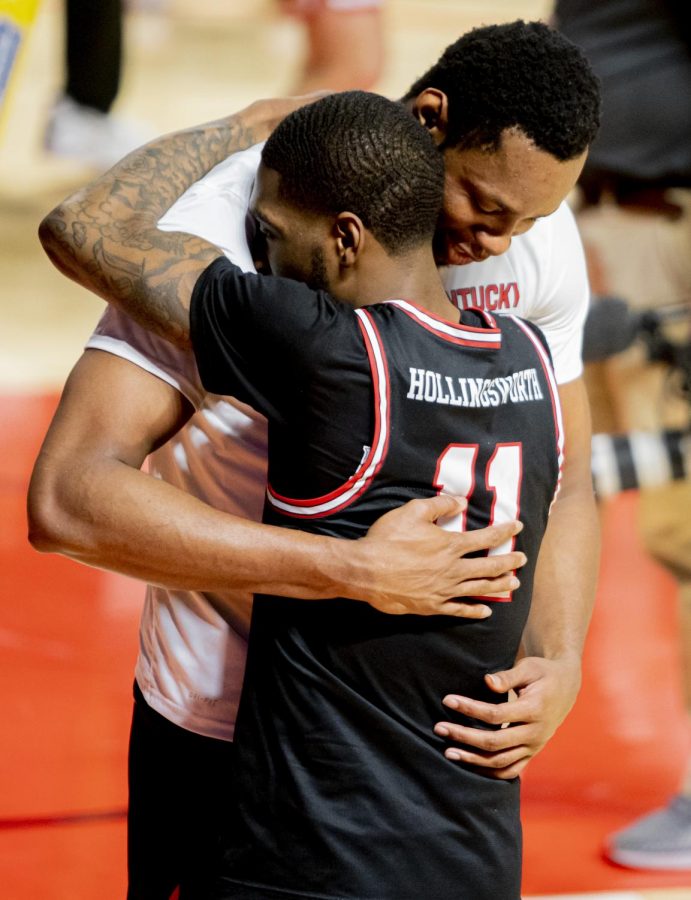Charles Bassey (23) and WKU Senior guard, Taveion Hollingsworth (11) celebrate with a hug after the game against Old Dominion on Saturday, March 6, 2021.