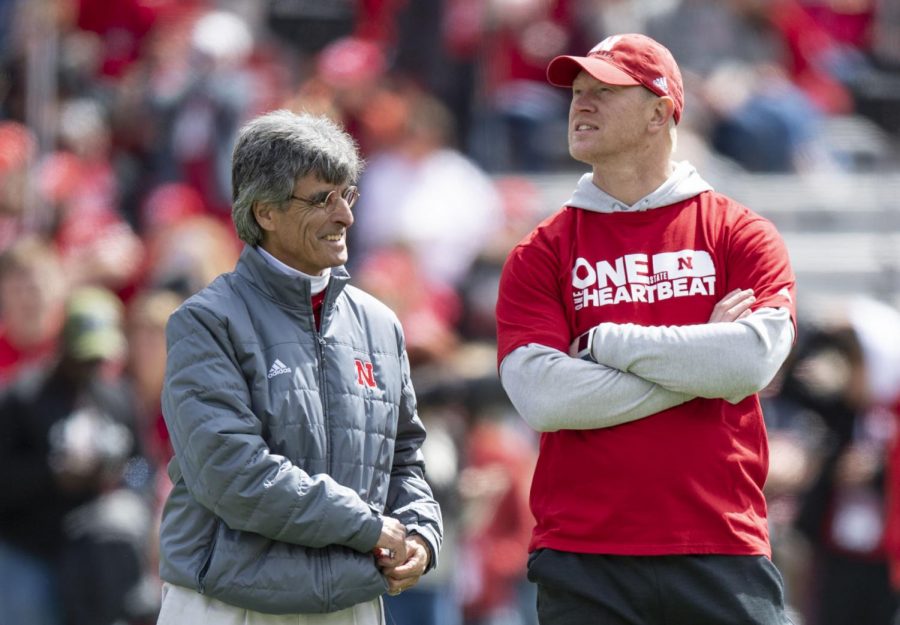 Nebraska head coach Scott Frost (right) talks with quarterback coach Mario Verduzco during warmups before the Red-White Spring Game in 2019.