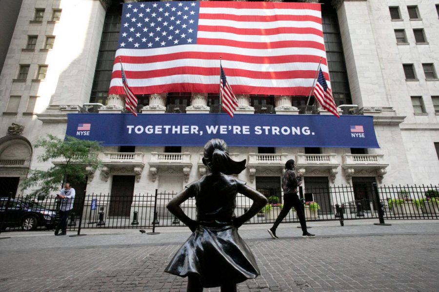 The Fearless Girl statue stands in front of the New York Stock Exchange, Thursday, July 9, 2020, in New York.