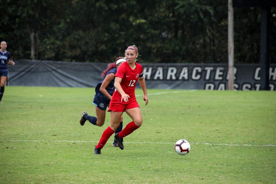 Avery Jacobsen dribbling the ball up the field against Old Dominion on Sunday Oct. 6, 2019 at the WKU Soccer Complex.