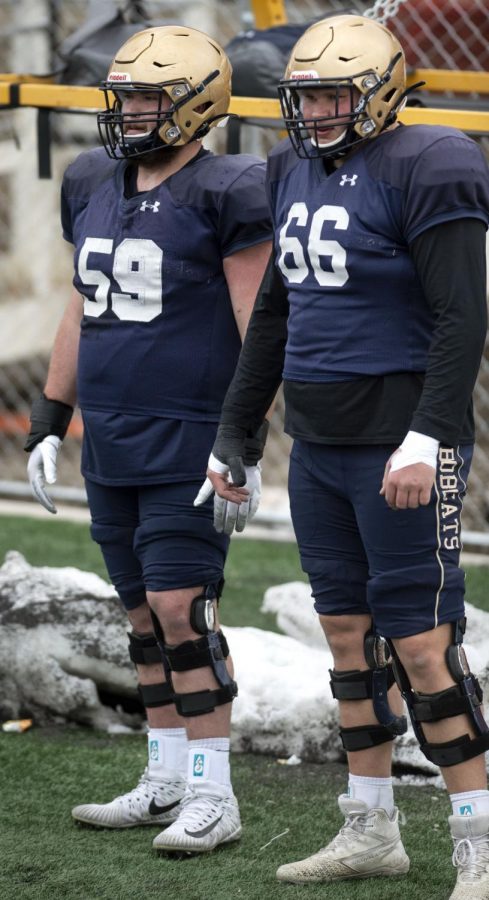 Montana State offensive linemen Zach Redd and Connor Wood chat during spring practice Saturday at Bobcat Stadium.