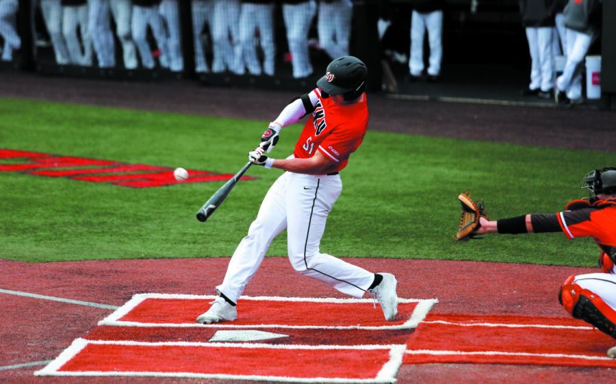 WKU outfielder Jackson Gray (51) swings at a pitch during the game against the Bowling Green Falcons at Nick Denes Field on March 14. WKU won 17-16.