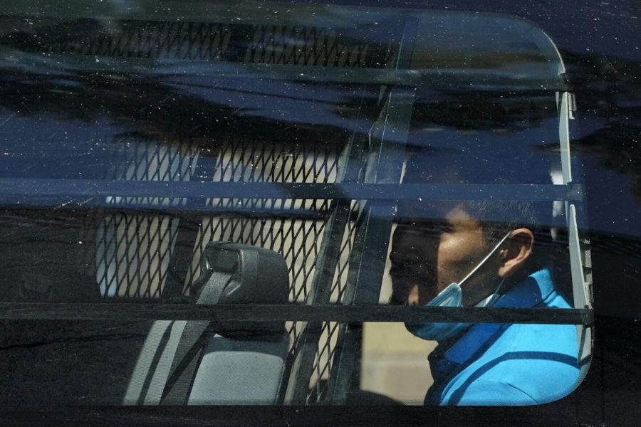 A migrant is seen inside of a van near a respite center after being released from U.S. Customs and Border Protection custody, Friday, March 19, 2021, in McAllen, Texas. A surge of migrants on the Southwest border has the Biden administration on the defensive. The head of Homeland Security acknowledged the severity of the problem Tuesday but insisted its under control and said he wont revive a Trump-era practice of immediately expelling teens and children.