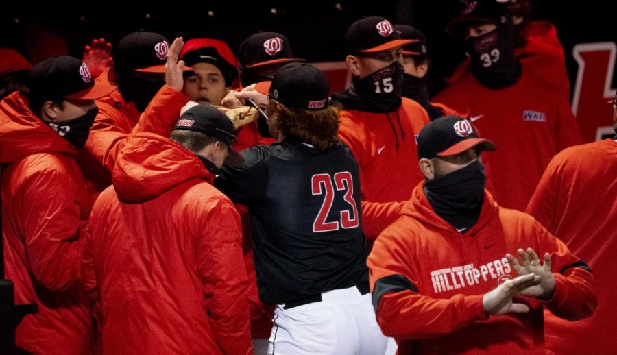 WKU+Junior+pitcher+Sean+Bergeron+%2823%29+celebrates+with+coaches+and+teammates+after+exiting+the+game+against+North+Dakota+State+on+Sunday%2C+February+21%2C+2021.