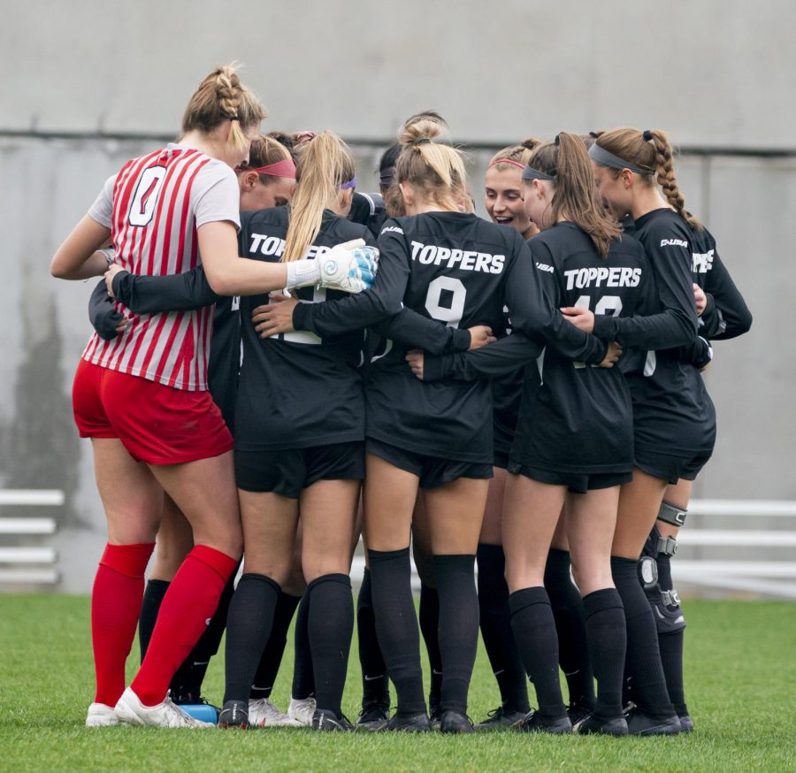 The WKU Soccer team huddled up before the game against Marshall Thursday, March 18, 2021 at the WKU Soccer Complex. 