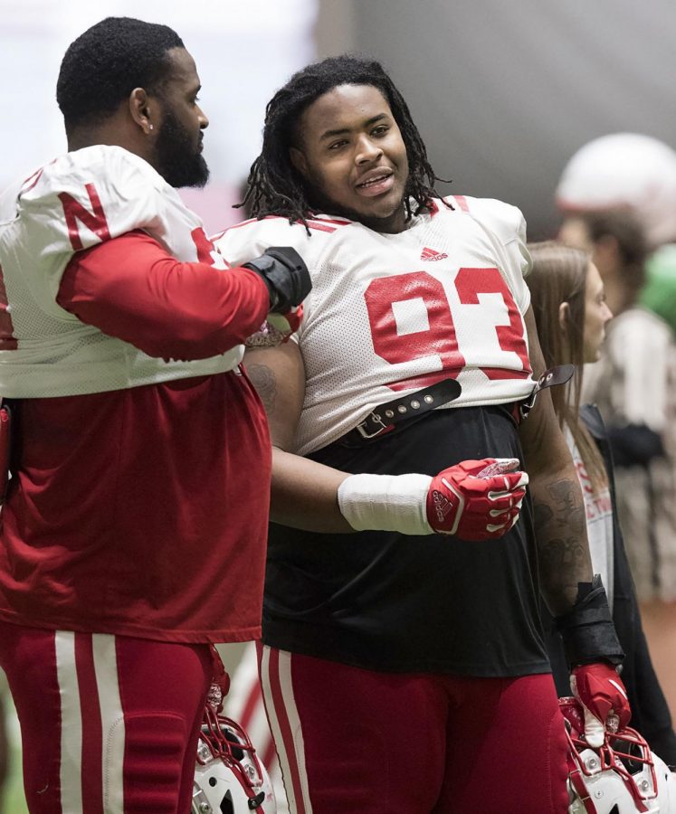 Damion Daniels (93) talks to his brother Darrion Daniels during practice at Hawks Championship Center in April 2019.