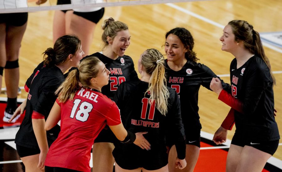 WKU Volleyball team celebrates during their game against Charlotte on Monday, Feb. 22, 2021 in Diddle Arena.