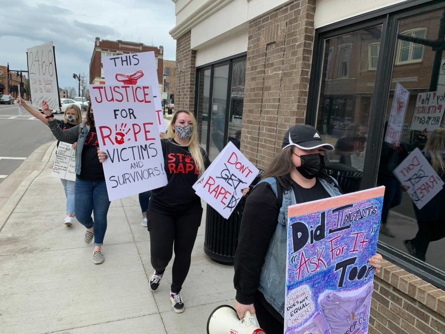 Chelsey Mather (front), Cassie Goodwin (middle), Lilia Hawkins (left end), and several other women marches downtown Bowling Green to educate people on rape culture has impacted not only WKU but countless of colleges across the US.