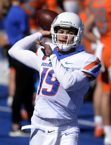 Boise State quarterback Hank Bachmeier (19) practices passing the ball on the sidelines during the spring football game at Albertsons Stadium on Saturday.