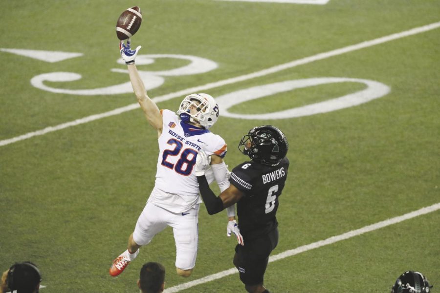 Boise State defensive back Kekaula Kaniho (28) breaks up a pass intended for Hawaii wide receiver Zion Bowens (6) during a game Nov. 21, 2020 in Honolulu.