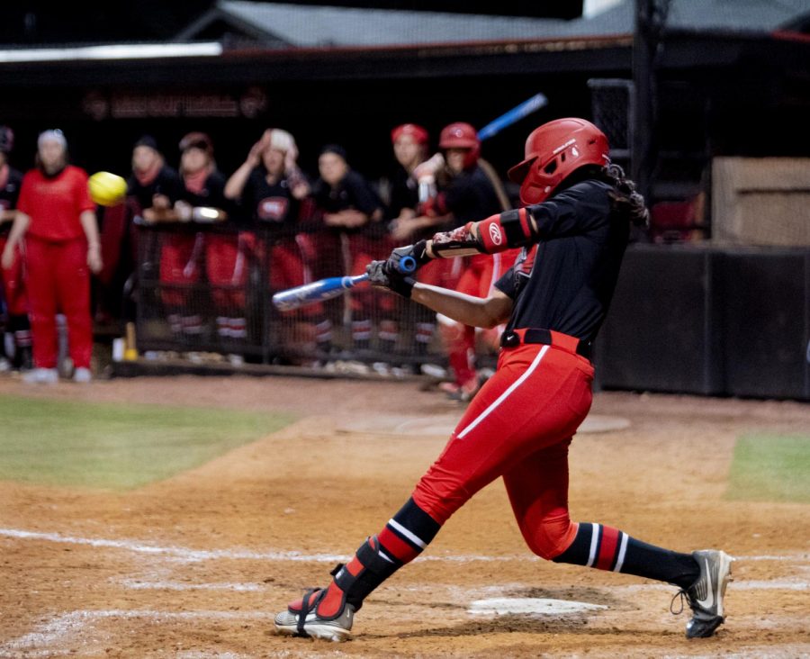 WKU pitcher, Kennedy Sullivan (4) hits a walk off hit in the 9th inning during the game against Kentucky on Wednesday, March 24, 2021.