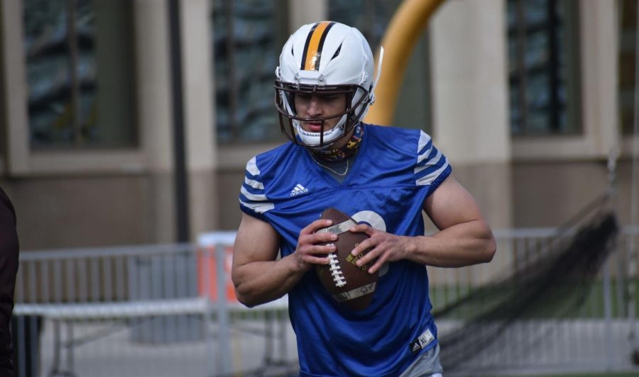 Wyoming quarterback Jayden Clemons runs through a drill during spring practice Thursday at War Memorial Stadium in Laramie. The Cowboys brought in the former Utah Ute as a walk-on to bolster their depth at the position.