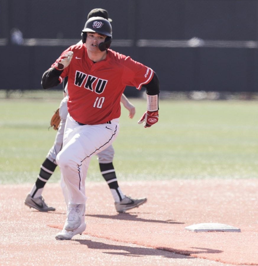 WKU’s Davis Sims (10) rounds second base against Wright State on Feb. 22, 2020 at Nick Denes field. WKU won 7-2.
