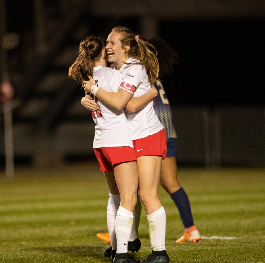 WKU women’s soccer players embrace after a big goal to put Western up two goals against their opponent FIU after their game on March 4, 2021.