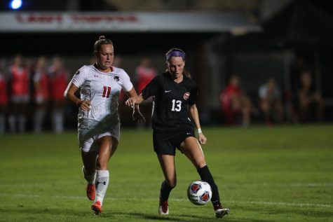 Junior forward Katie Erwin keeps the ball away from a defender during the Hilltoppers season opener against Austin Peay on Aug. 19, 2021. Erwin would score a goal and provide an assist during the match.