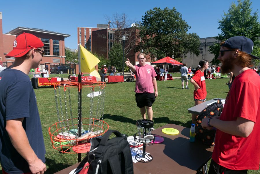 Members of WKU Disc Golf Club Michael Netherton, Aaron McGillivray and Ryan Messenger (left to right) man an information table to drum up student interest at Discovery Fest on Tuesday afternoon.