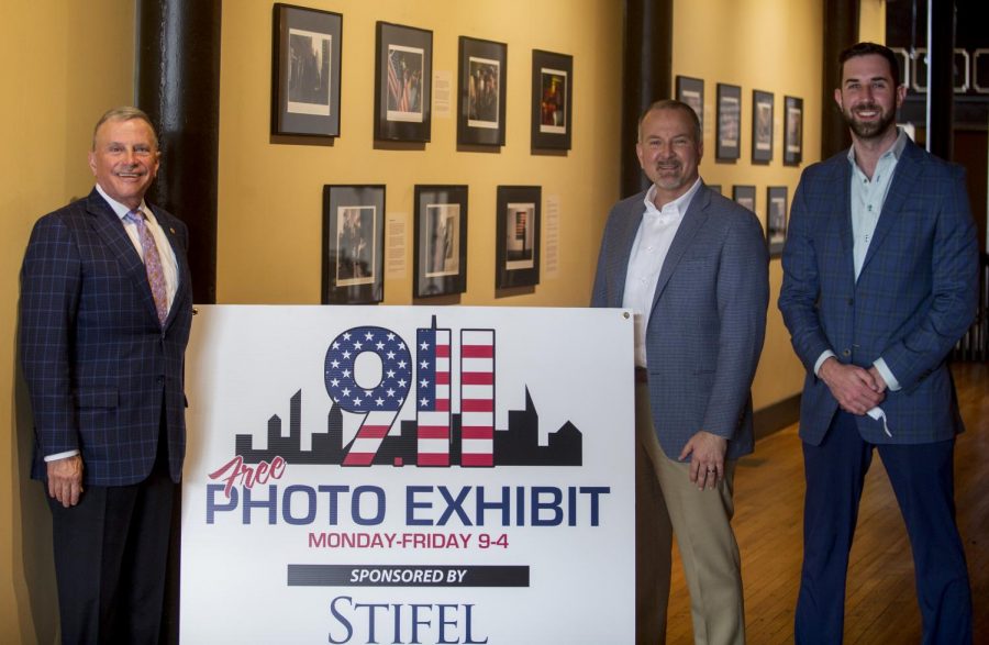 John Ridley, Derek Hull, and Drew Martin are partners and sponsors of the 9.11 Photo Exhibit at 400 E. Main Street. Above, they pose in front of the gallery on its opening day, Sep. 10, 2021.