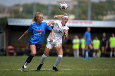 WKU Hiltoppers junior midfielder Lucy Lyon (19) competes against Ole Miss Rebels senior Channing Foster (12) for control of the ball during the Sunday afternoon match.