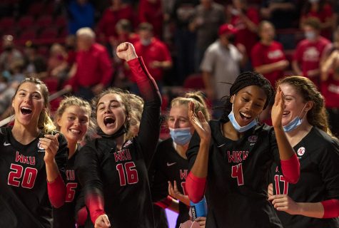 The WKU volleyball team celebrates after winning the match against St. John’s University at Diddle Arena on Sept. 18, 2021.