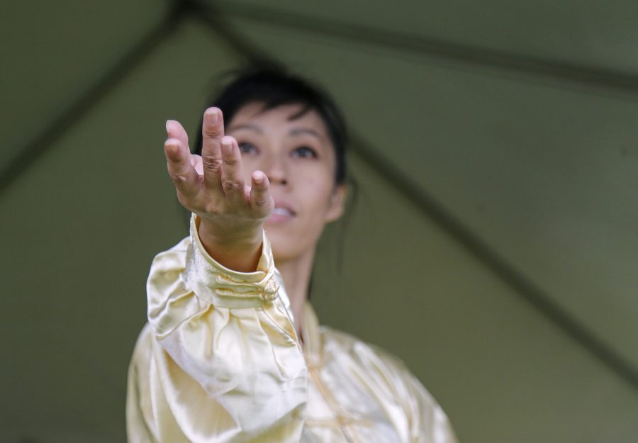 Yan Zhuang, member of the Confucius Institute at Western Kentucky University, performs a traditional Chinese dance at the Bowling Green International Festival.