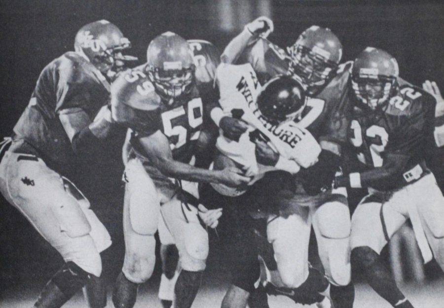 WKU defenders swarm UCF’s Mark Whittemore in WKU’s 50-36 upset defeat of the No. 19 Knights on homecoming night in 1992.