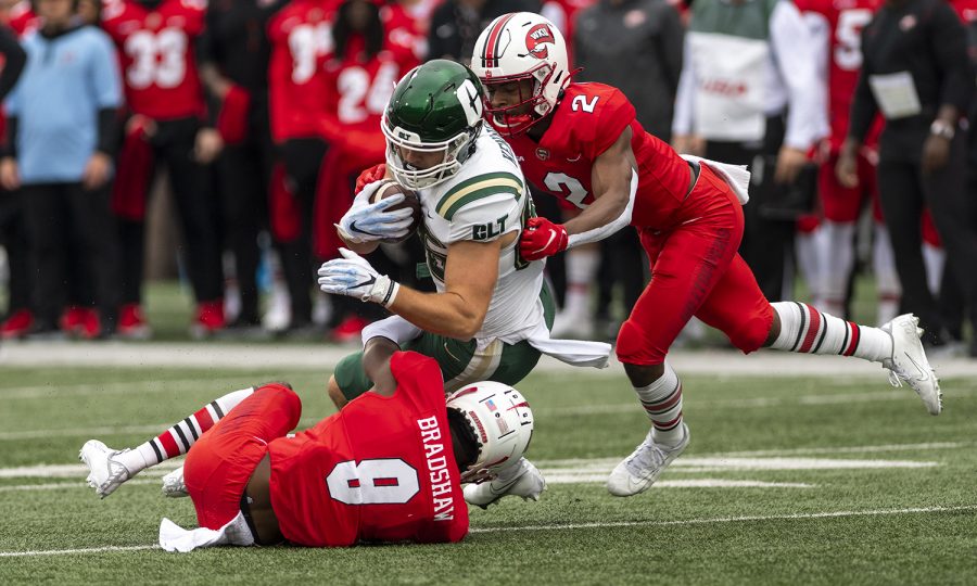 WKU defensive back Dominique Bradshaw (9) and A.J. Braithwaite, Jr. tackle a Charlotte 49ers players during the game at L.T. Smith Stadium on Oct. 30, 2021.