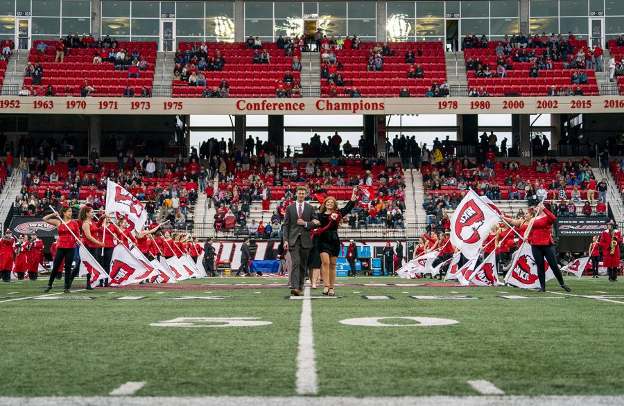 Members of the 2021 homecoming court walk down Fiex Field during the WKU v Charlotte football game at L.T. Smith Stadium on Oct. 30, 2021.