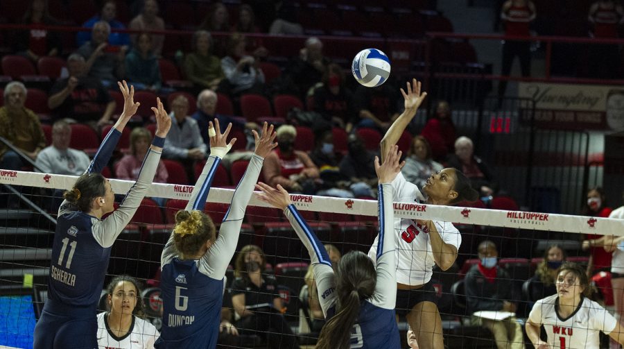 WKU+Hilltoppers+senior+middle+hitter+Lauren+Matthews+%285%29+spikes+the+ball+over+three+Old+Dominion+players+during+the+match+on+Oct.+28%2C+2021.