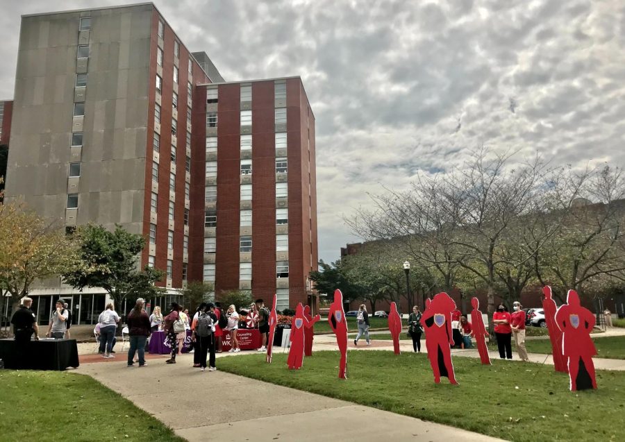 Cutouts with names and experiences of victims of domestic abuse were placed in Centennial Mall on WKU’s campus for a Domestic Violence Awareness event on Oct. 5, 2021. There were also tables with information and prizes people at the event could go to.