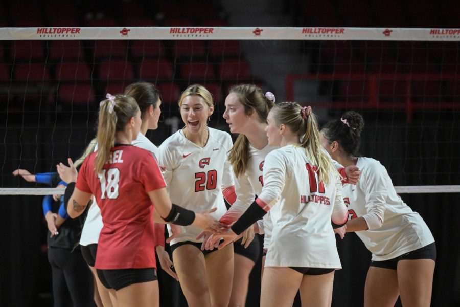 The WKU Hilltoppers celebrate after a point against the MTSU Blue Raiders on Friday, Oct. 15 of 2021 during a match WKU won 3-0 in Diddle Arena.