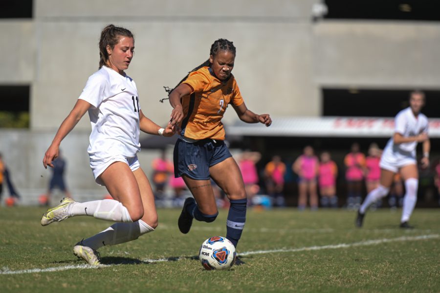 Lady Topper sophomore defender Ellie Belcher (11) and UTEP Miners junior forward Kam Fisher jockey for control of the ball during a match the Hilltoppers lost 2-0 on Sunday afternoon, Oct. 17 of 2021, at the WKU Soccer Complex.