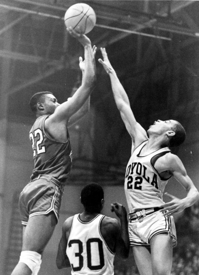 Clem Haskins (22) takes a shot over a Loyola defender on March 7, 1966. Haskins was named the Ohio Valley Conference Player of the Year that season.