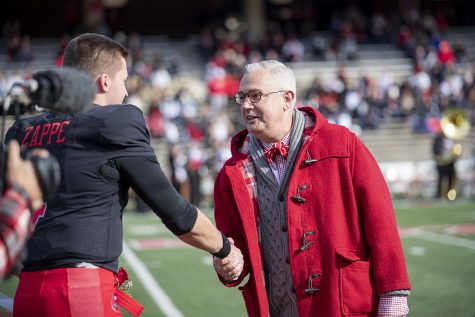 WKU President Timothy Caboni shakes hands with Hilltoppers’ senior quarterback Bailey Zappe during senior day festivities.
