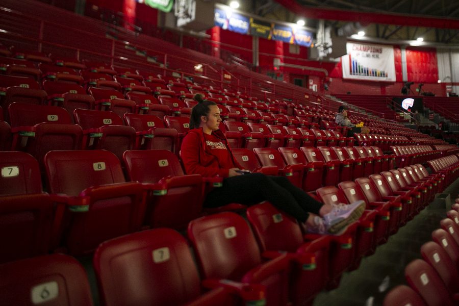 WKU freshman architecture major Maddie Dabis sits in the student section of Diddle Arena before the Lady Toppers’ opening conference match against the Purdue Boilermakers on Wednesday evening, Nov. 10 of 2021. Western lost the match 79-69.