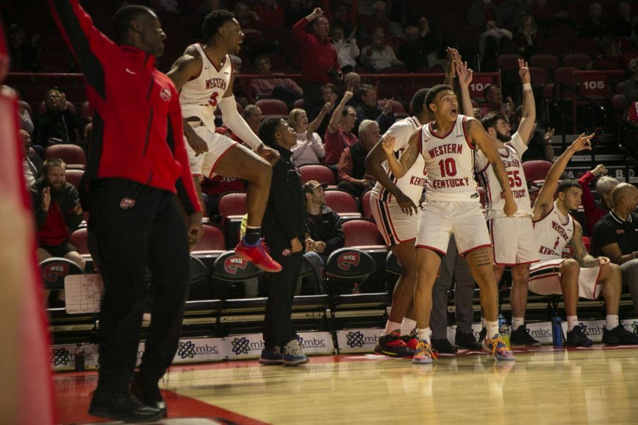 The+WKU+bench+celebrates+during+the+Hilltoppers+105-35+rout+of+Rhodes+College+on+Nov.+30%2C+2021.