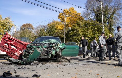 State troopers work to secure the premises after a pursued stolen vehicle wrecked at the intersection of East 13th Avenue and State Street on Nov. 9, 2021. The driver collided with two other vehicles, and the occupants of the those vehicles did not report injuries.