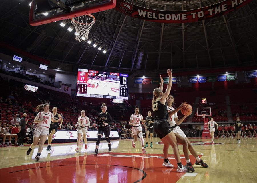 WKU Lady Toppers’ freshman guard Mya Meredith (5) drives for a shot against West Virginia State University Yellow Jackets’ freshman guard Abby Faulkner (23) during an exhibition match Wednesday evening, Nov. 3 of 2021 in Diddle Arena. WKU won the match 112-72. 